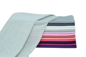 Detailed stack of colorful mercerized cotton jersey headscarves in various soft tones