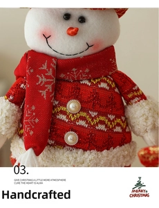 Close-up of Christmas snowman plush doll with red knit sweater and pearl buttons