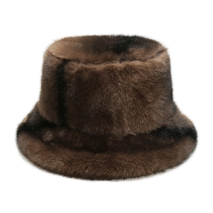 Macro detail of thick dark brown faux fur bucket hat showing soft dense plush texture