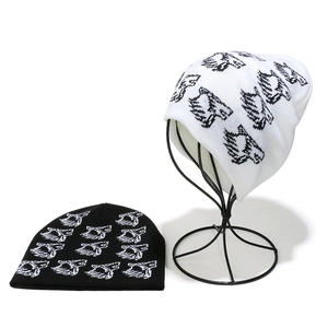 Knit beanie with pixel pattern print in black and white colors for outdoor warmth
