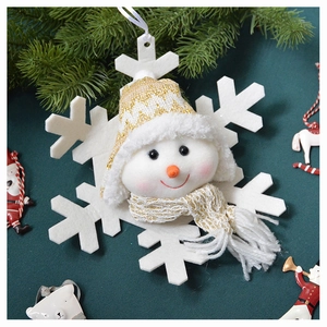 Detail of plush snowman hanging ornament on white felt snowflake with gold knit hat