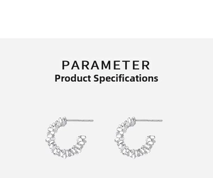 Macro detail of S999 sterling silver C-shaped earrings with irregular textured surface