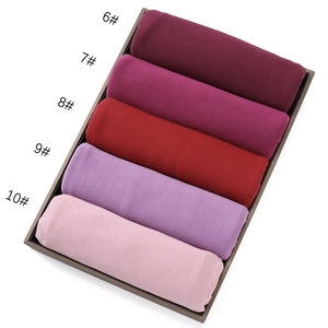 Detail view of five assorted mercerized cotton scarves in a row for color selection
