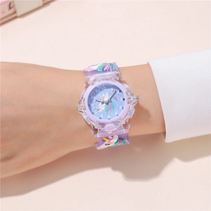 Close-up of kids quartz watch with 3D cartoon unicorn on purple silicone strap
