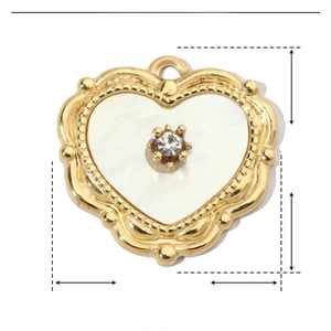 Detail view of heart-shaped shell pendant with stainless steel frame and crystal
