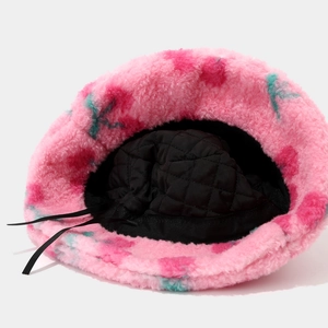 Plush bucket hat with floral print and black quilted lining for winter warmth