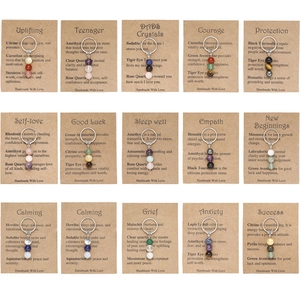 Set of 15 handmade gemstone keychains with healing crystals on kraft display cards