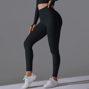Close-up of seamless black high-waisted yoga leggings showing the wide waistband fit