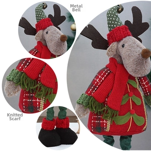 Detail of Christmas reindeer doll showing metal bell, knitted neckerchief and plush texture