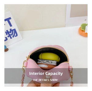 Pink quilted mini bag interior detail showing storage for headphones and small items
