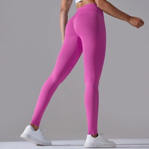 Close-up of seamless yoga pants in rose pink showing high waist and booty lifting contour