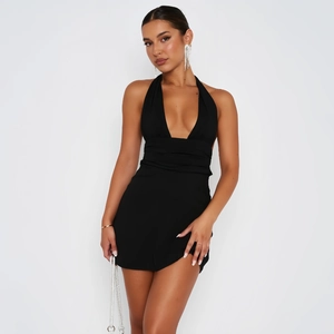 Detail of black deep V-neck halter mini dress with pleated waist and slim fit design