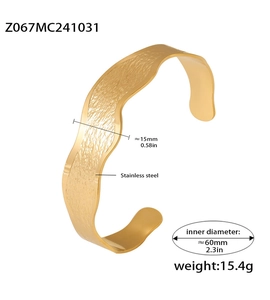 Detailed view of wave-textured gold stainless steel bangle with dimensions and weight info