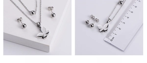 Close-up showing a 1.5cm butterfly pendant size on a double-layer silver steel necklace