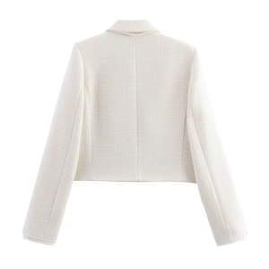 Back view of a white cropped tweed jacket showing detail of collar, shoulder and hem stitches