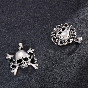 Vintage gothic pirate skull pendants in silver titanium steel for men on black background