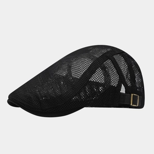 Detail of breathable black mesh fabric and adjustable gold metal buckle on flat cap