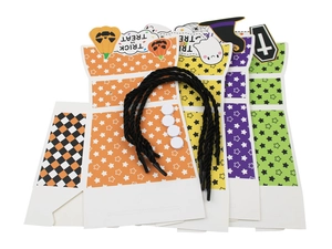 Detailed view of Halloween trick or treat candy boxes in four colors with black ropes