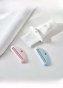 Three-piece manual tube squeezers with hanging holes for toothpaste and facial cleansers