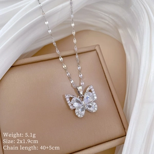 Macro detail of silver butterfly pendant with cubic zirconia, size 2x1.9cm and 5.1g weight