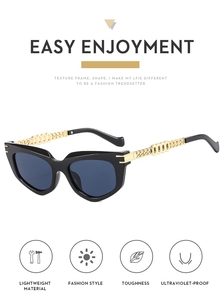 Detail of vintage cat-eye sunglasses with golden chain temples and UV protection