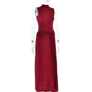 Detailed view of red sleeveless fishtail dress with sparkling fabric and waist tie design