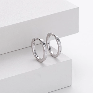 Detailed macro view of S925 sterling silver hoop earrings with small zircon stones