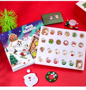 Detailed Christmas advent calendar set with 24 festive metal enamel charms and gift box