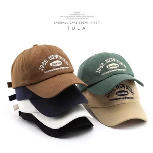 Detail of multi-color cotton baseball caps with vintage 1989 New York embroidery