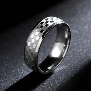 Men's 6mm silver titanium steel ring with embossed checkered pattern on a dark background