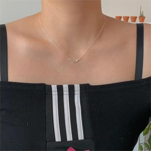 Minimalist 925 sterling silver interlocking hook necklace worn as an elegant clavicle chain