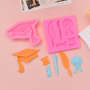 Graduation theme silicone mold for fondant featuring mortarboard, quill, and diploma