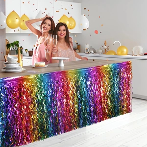 Close-up of vibrant iridescent fringe table skirt with metallic reflective party texture