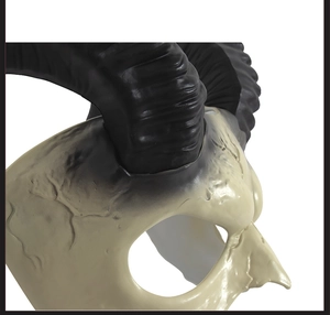 Macro view of white devil horn mask with realistic spiral texture and aged finish