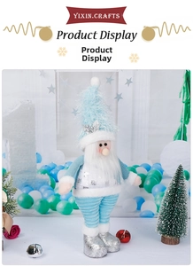Detail of a blue Christmas gnome with silver sequin top and light blue plush hat decoration
