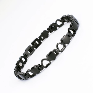 Fashionable black heart link magnetic therapy bracelet for women in a curved layout