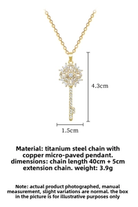 Macro detail of gold hollow flower key pendant showing 4.3cm length and fine zircon inlay