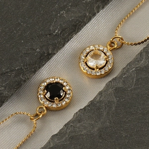 Double layered 18K gold stainless steel necklace with round zircon pendants on silk and stone