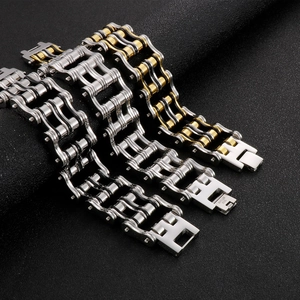 Detail of bicycle chain style stainless steel bracelets in gold and silver finish