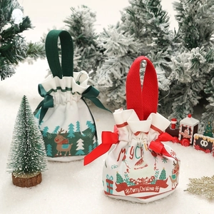 Christmas drawstring velvet gift bags featuring Santa and reindeer with festive ribbons