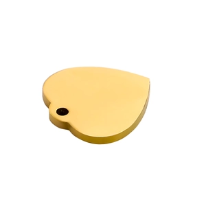 Macro view of a 18k gold heart-shaped stainless steel pendant with high polish finish