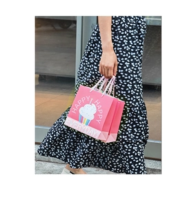 Detail of pink cartoon cupcake paper gift bag with HAPPY EVERYDAY print