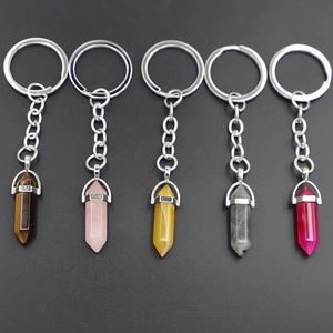 Set of five hexagonal natural crystal stone keychains in diverse colors with metal rings