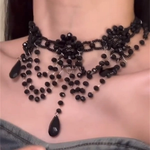 Gothic style black seed bead choker necklace with teardrop pendants on female model