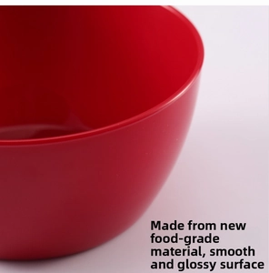Detailed macro view of the polished food-grade plastic bowl rim with smooth red finish