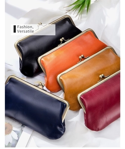 Multiple colors of vintage leather long wallets with classic metal clip closures