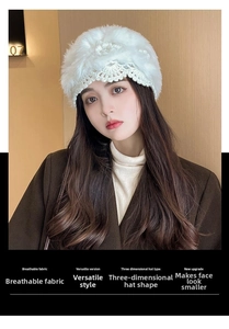 Detailed knit texture of white fuzzy crochet flower beanie with ear protection