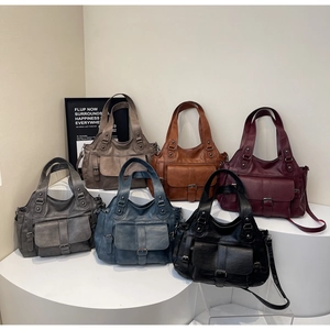 Variety of retro PU leather tote bags in six colors shown on minimalist display stands