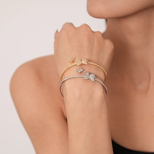 Elegant double-layer open bangle with zircon butterfly and flower charms in gold and silver