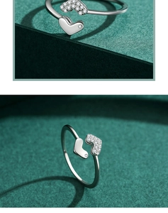 Macro view of adjustable S925 silver ring featuring one polished and one pavé heart